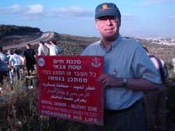 History Professor Gregory J. W. Urwin near the security fence along Israel’s border with the Western Territories near Umm el-Fahem in late May.