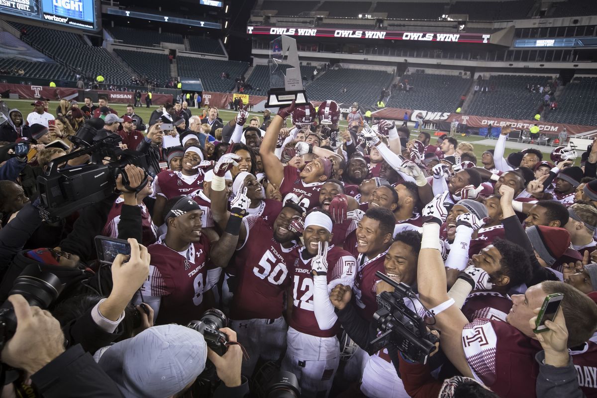 The Temple Football team celebrating a conference championship title in 2016. 