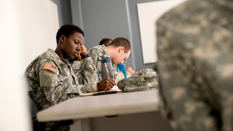 ROTC students in uniform sitting in class