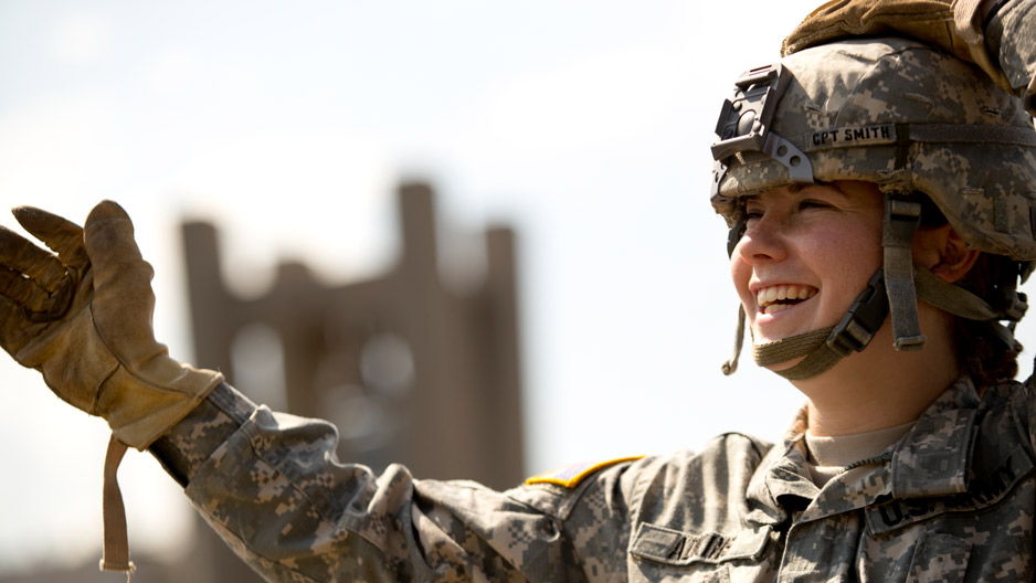 ROTC student smiling while preparing to rappel from a building at Temple