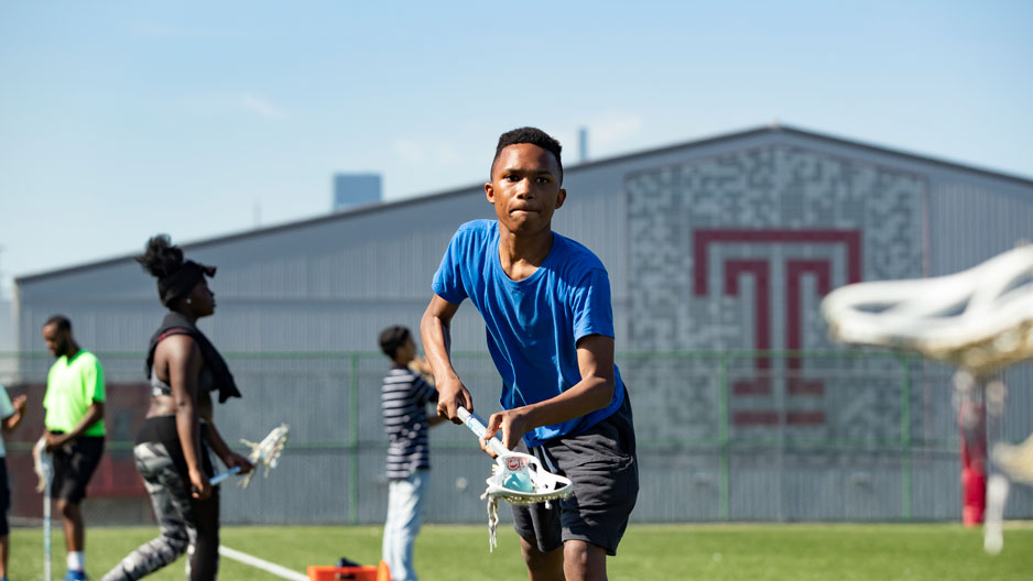 students playing lacrosse