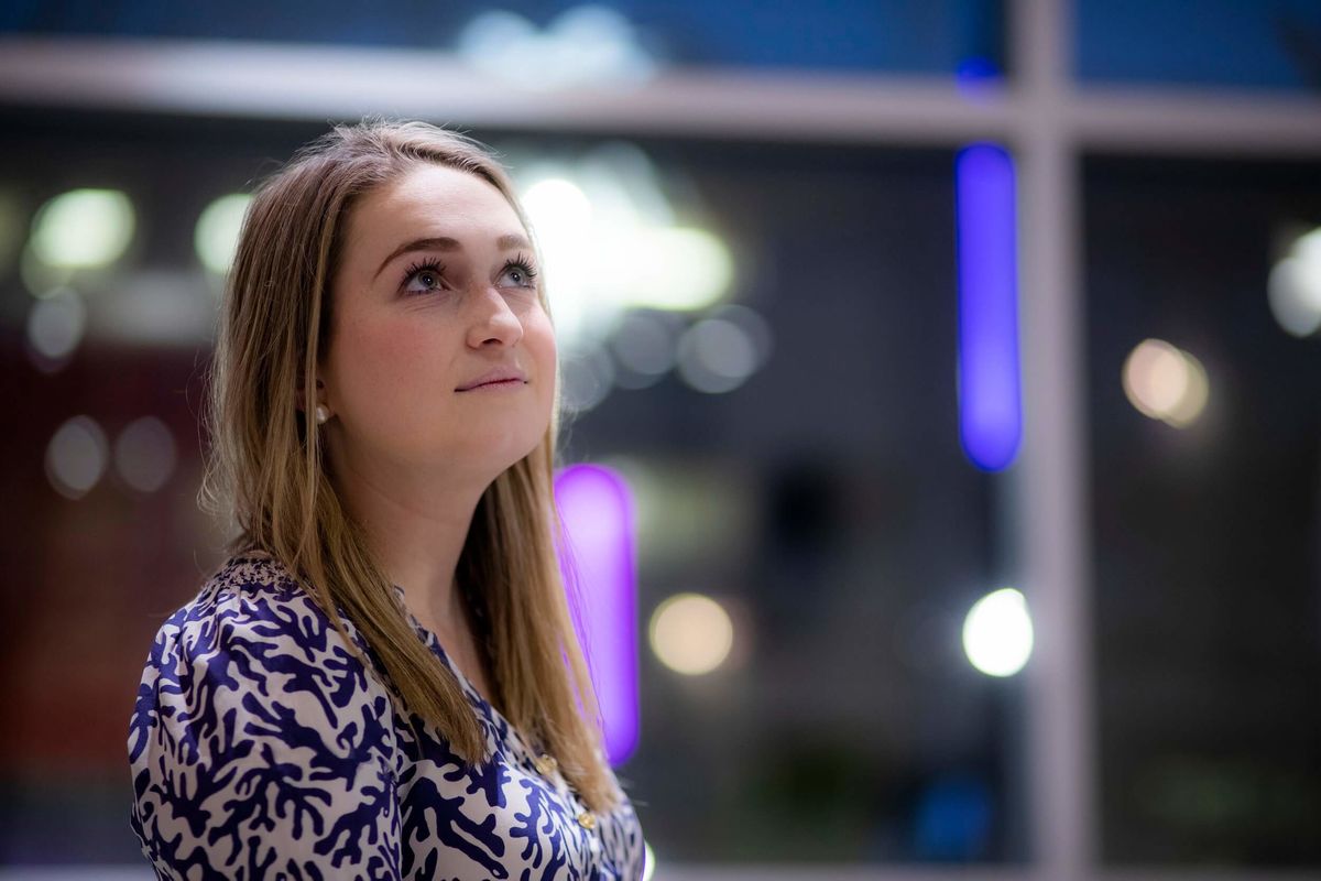 Boyer music therapy student Allie McCrea stands in the lobby of the Tyler School of Art and Architecture.