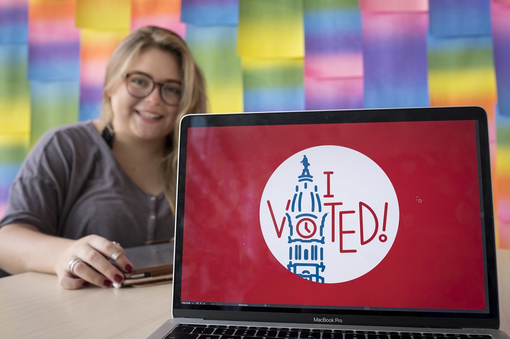 Student Kate Fish showing her design for the Philadelphia "I voted" sticker. 