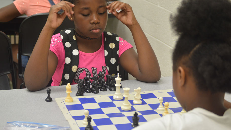 fifth grade camper D’Miyah playing ESF Senior Camp Chess