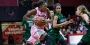 A Temple women’s basketball player holding the ball while making a play.