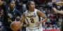 A Temple women’s basketball player dribbling the basketball.