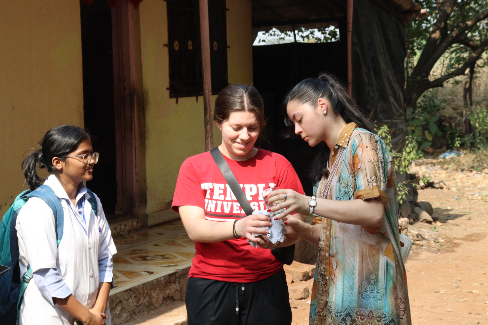 Temple and MGM students conducting a water treatment activity