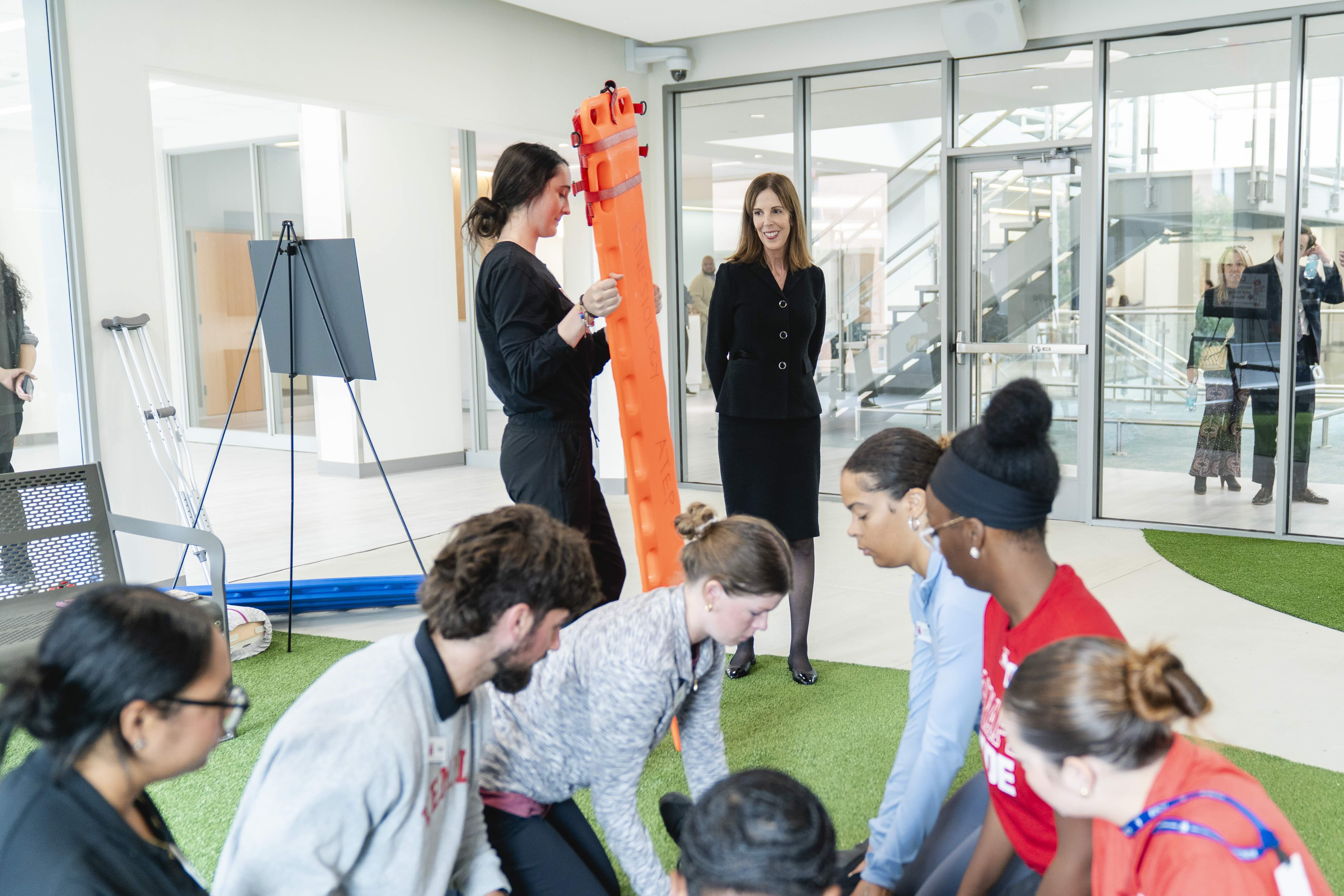 During Paley Hall’s Grand Opening, Nancy Fawley visits the Simulation Center’s park—her family’s gift to CPH in honor of her great-aunt, Miriam “Auntie Mir” Semple.