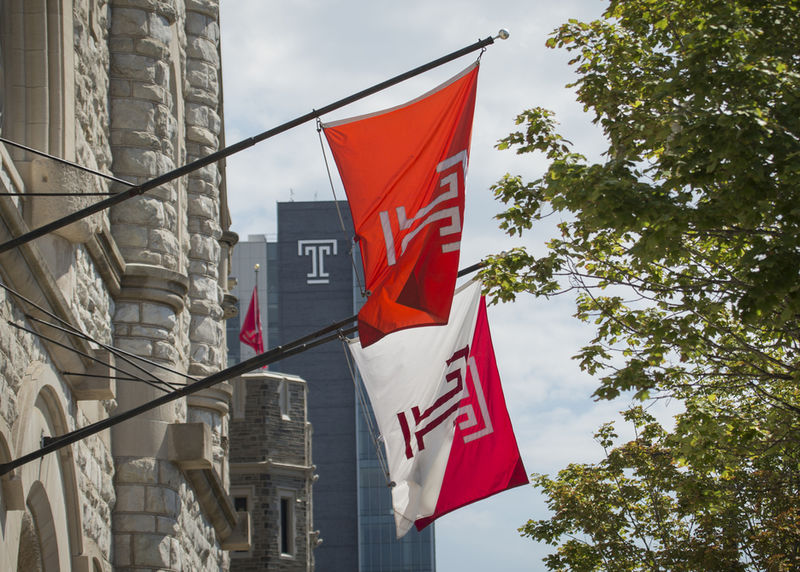 Temple Flags hanging off a building. 