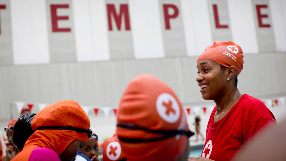 female swimmers share a laugh after competition