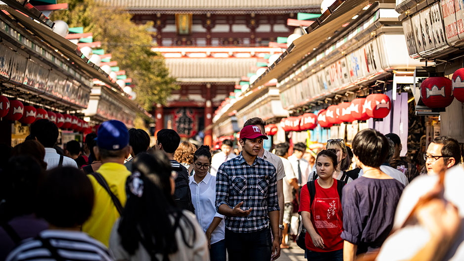 People walking down a street in Tokyo