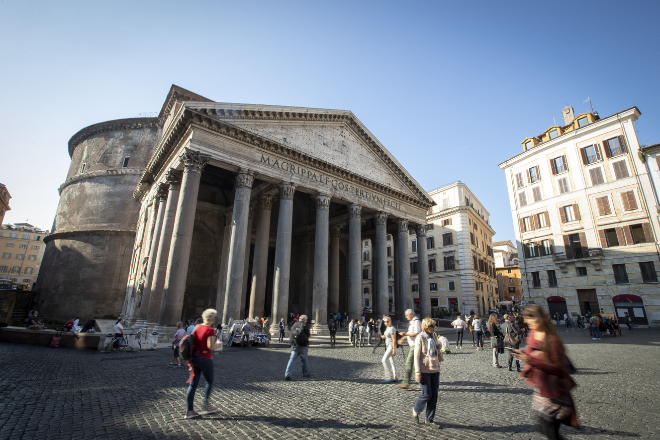 People walk past the Pantheon in Rome.