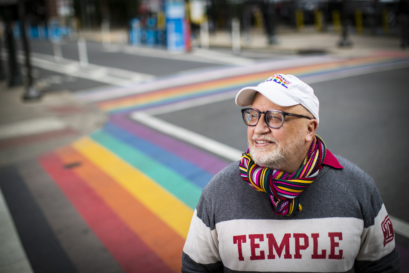 Scott Gratson standing at the rainbow crosswalks on 13th and Locust in Philadelphia