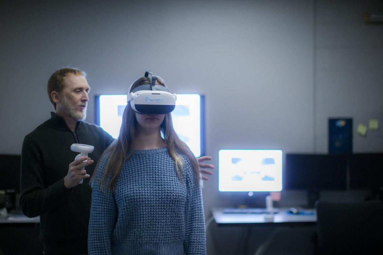 W. Geoffrey Wright with a research assistant wearing the UprightVR headset in the Motion-Action-Perception Laboratory