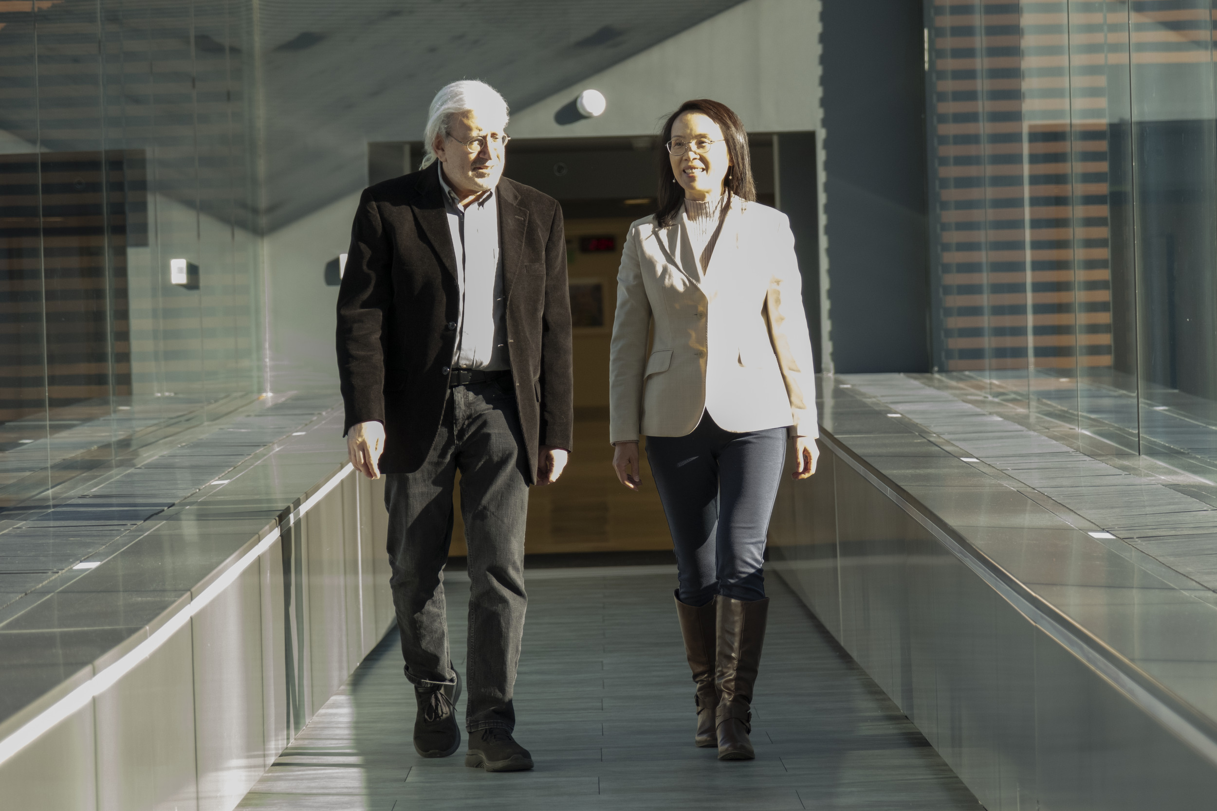 Steve Balsam ad Connie Mao walking in the Skybridge.