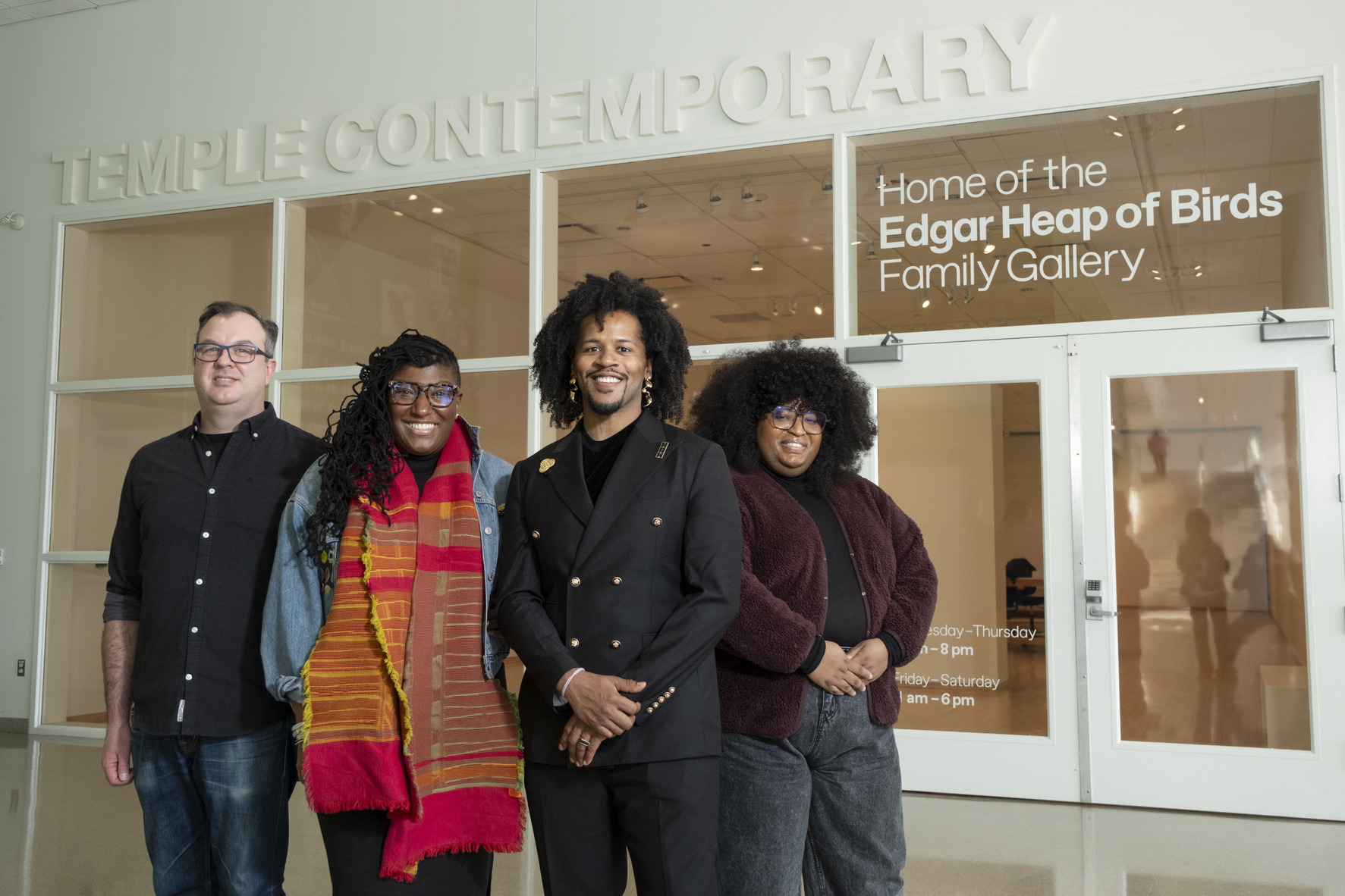 Temple Contemporary leaders stand in front of a gallery