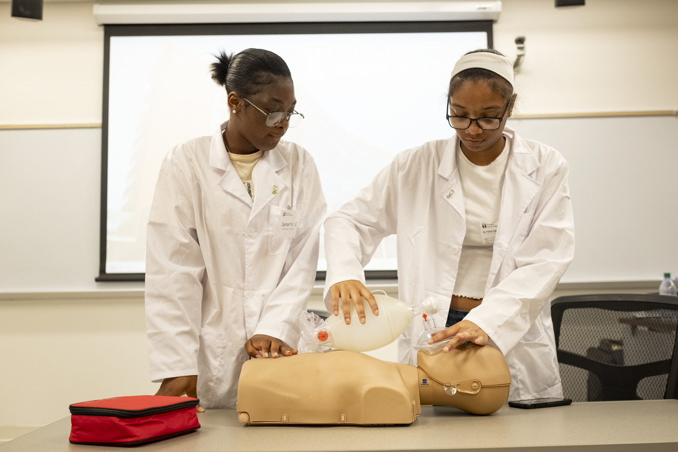 High school students learn how to perform CPR during the mini-medical school program.