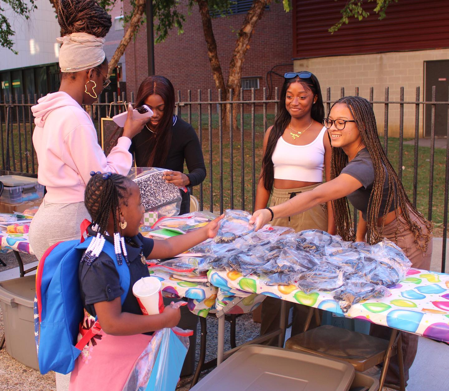 Black Student Union members hand out school supplies in the fall 2023