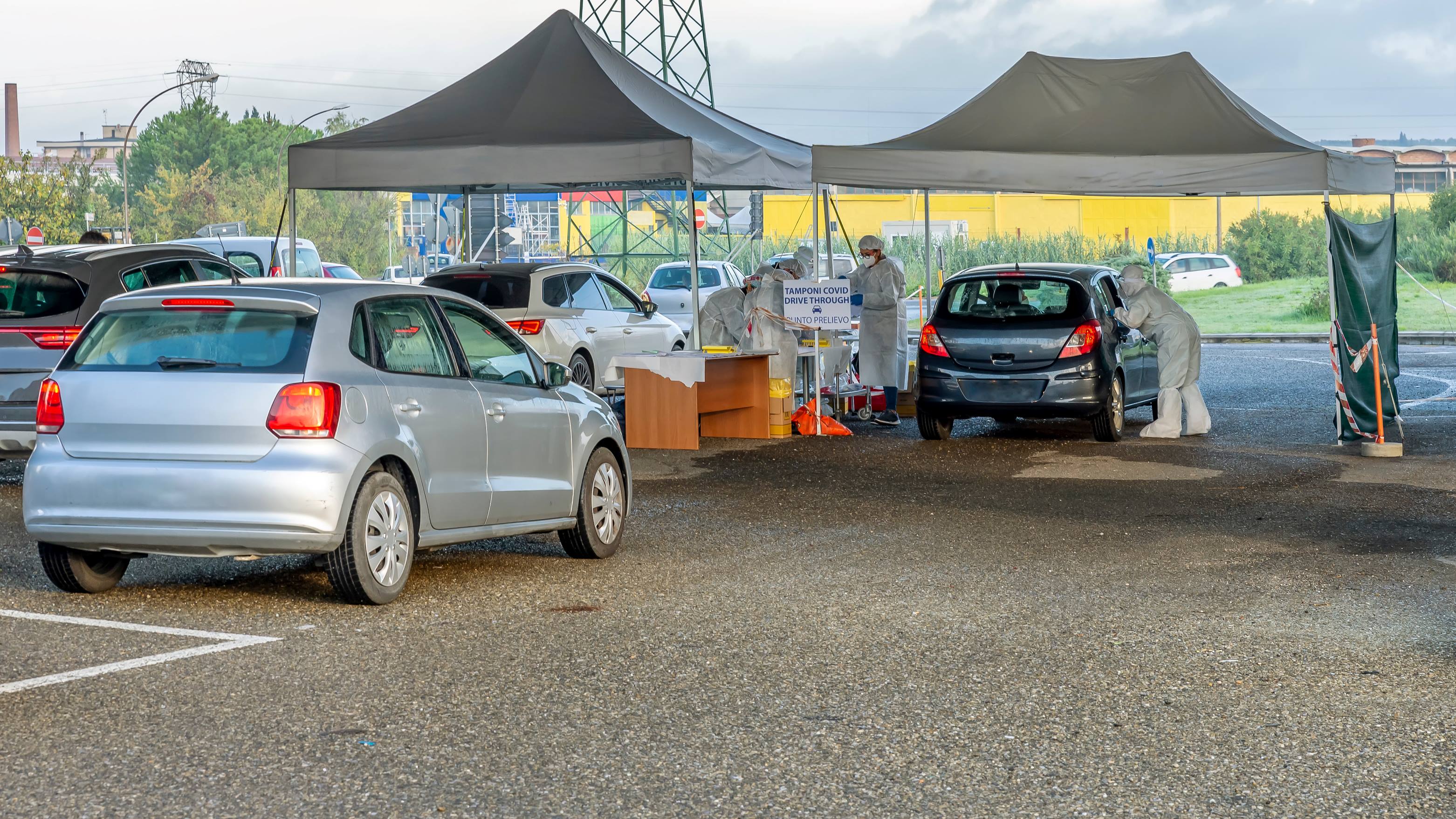 Cars drive up to a COVID-19 mobile testing site