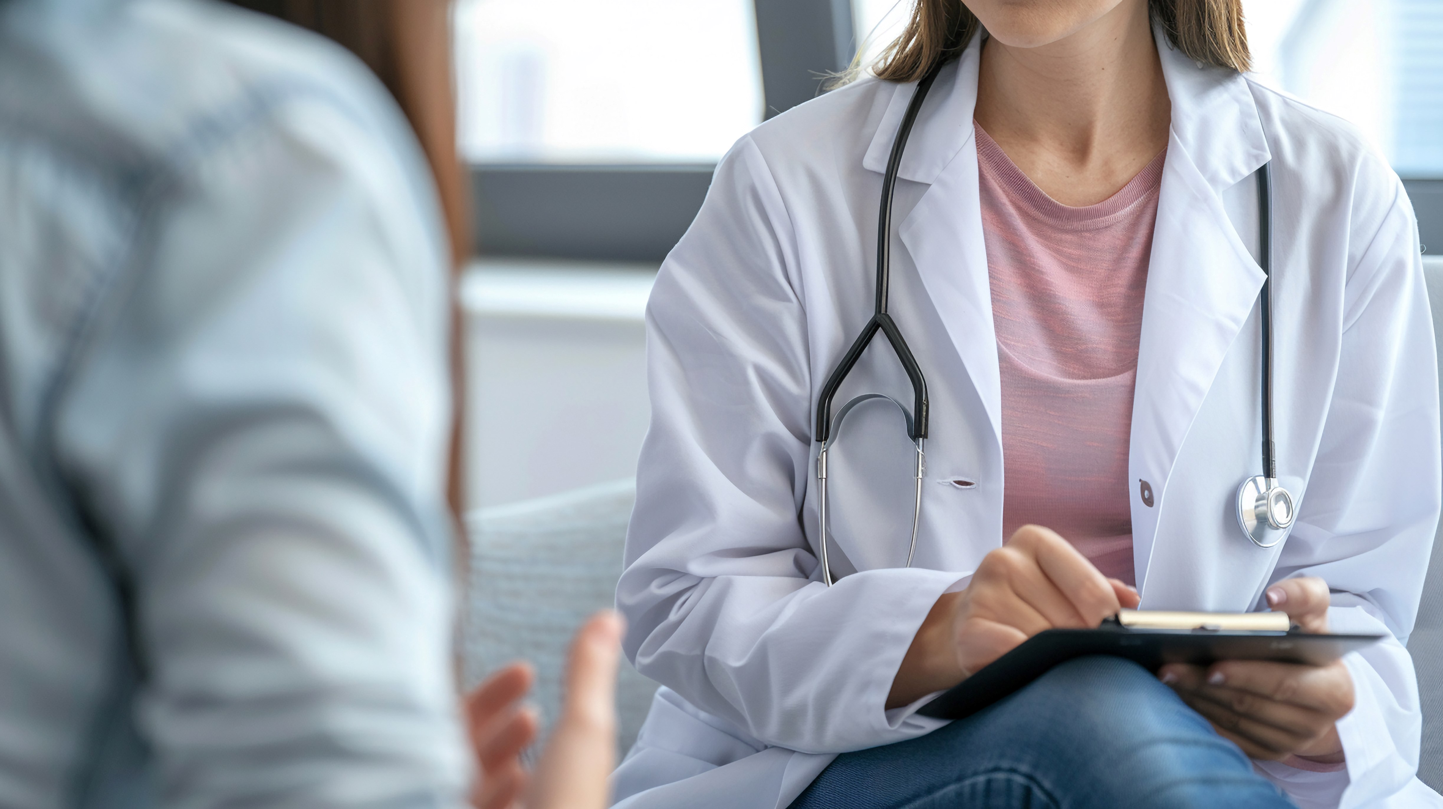 A doctor speaks with a patient