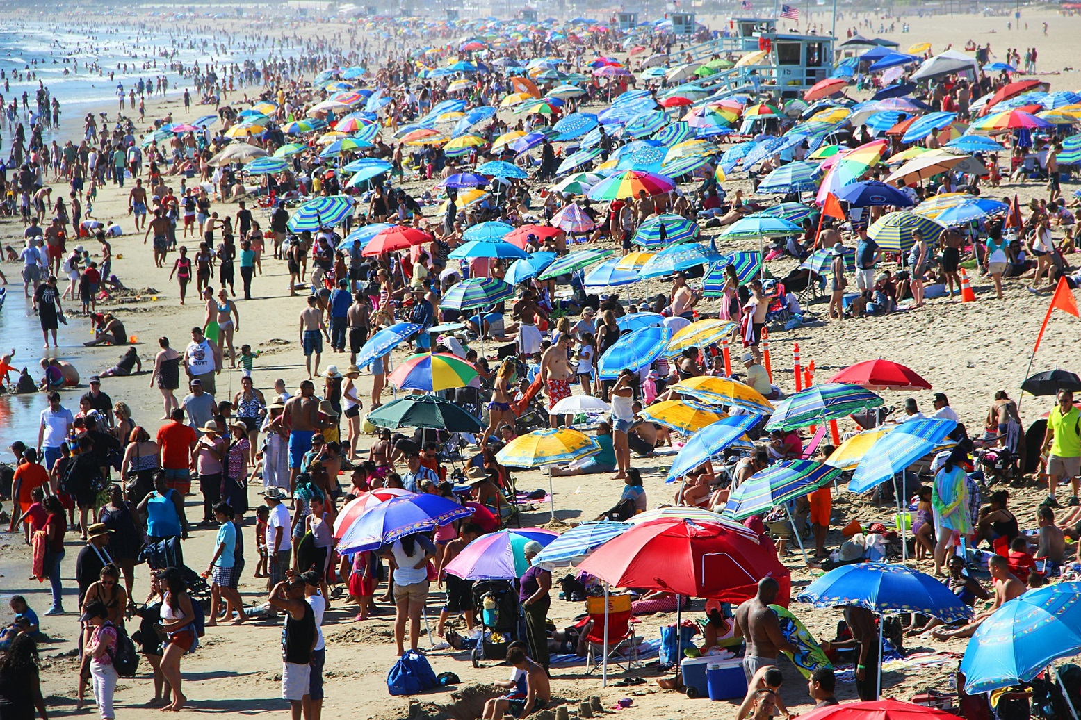 Crowded beach pictured.