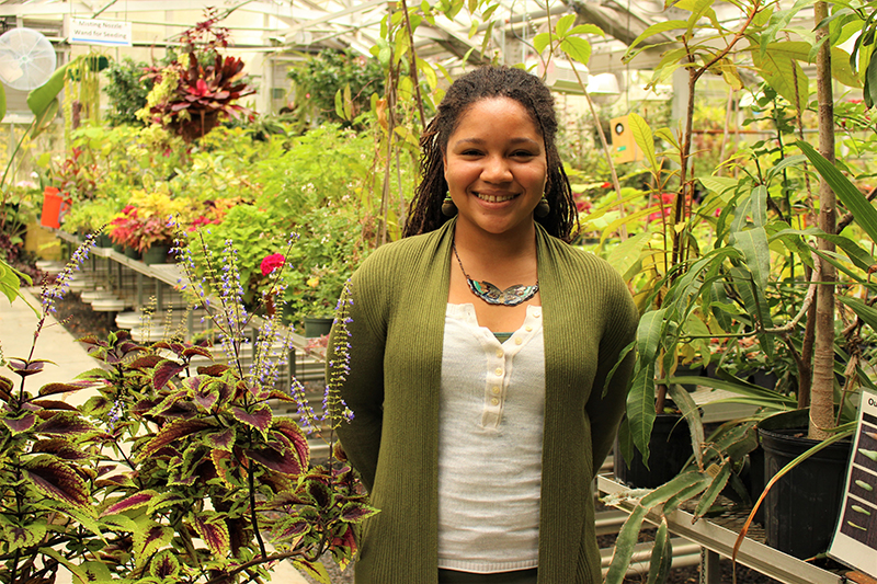 Amirah Mitchel in the greenhouse