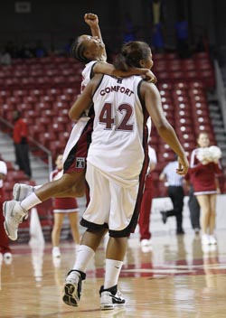 The Lady Owls celebrate after an early-season win over George  Washington.