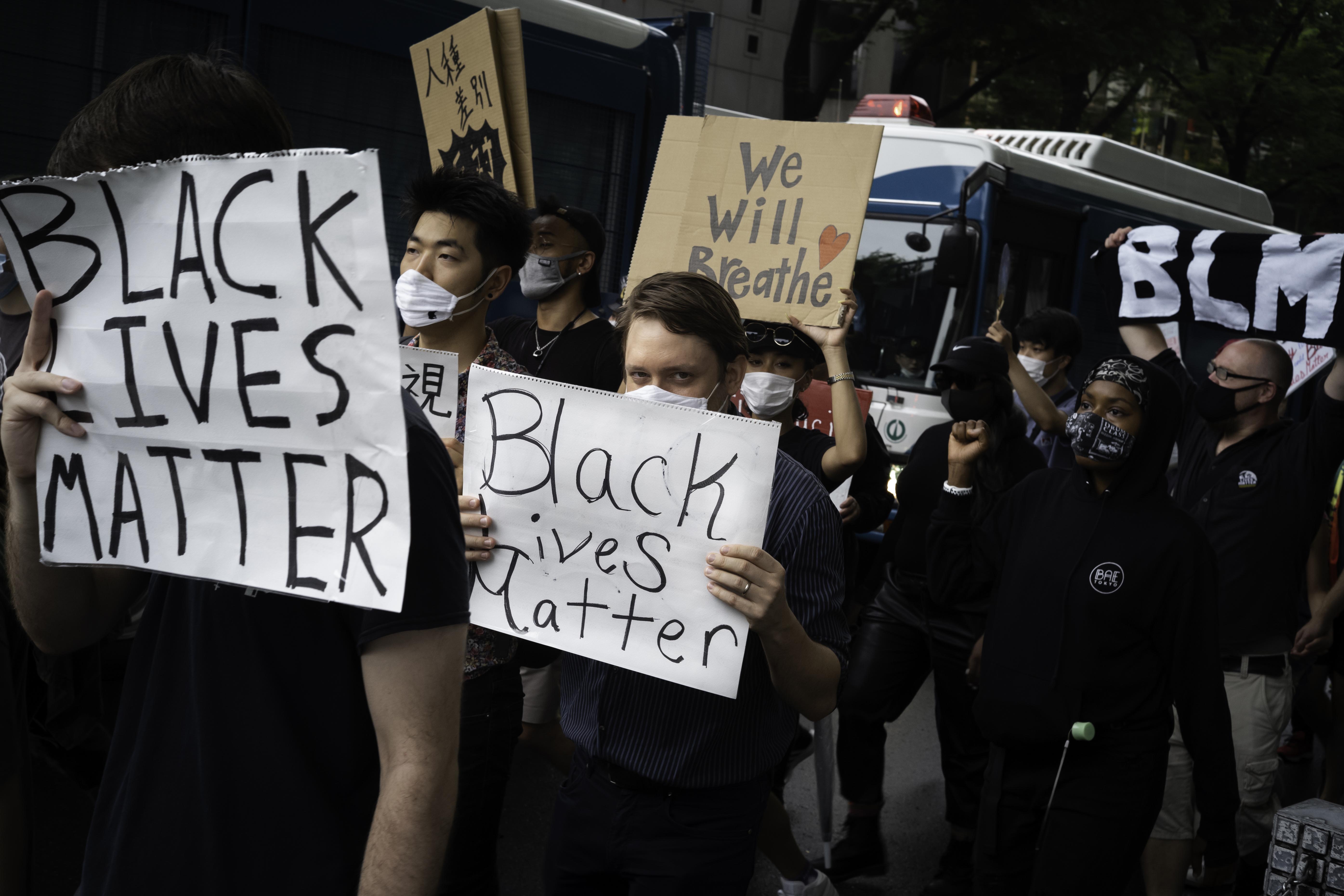 protesters marching in Tokyo