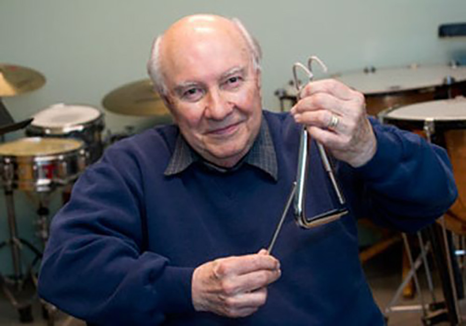 Alan Abel holding a triangle