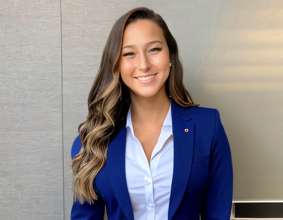 headshot of Mary wearing a blue blazer and button down shirt