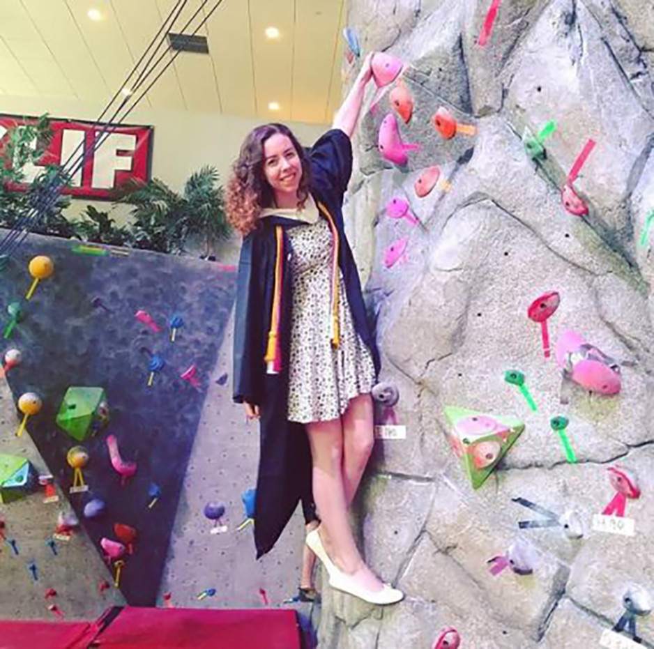 Graduate climbing rock wall