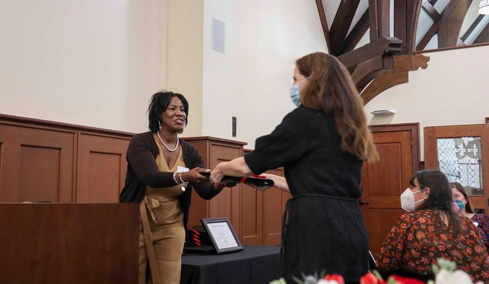 image of faculty member receiving their award from Faye Richardson