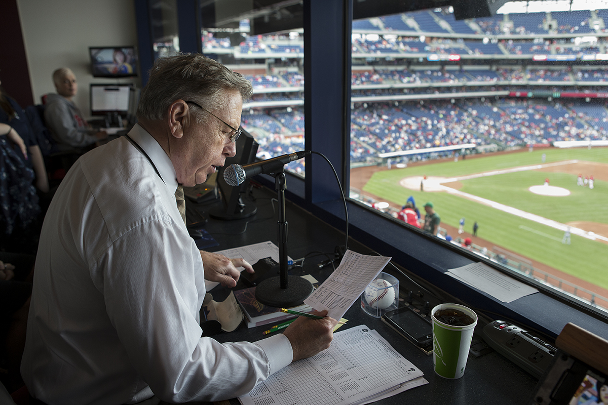 Dan Baker reading in a control room.