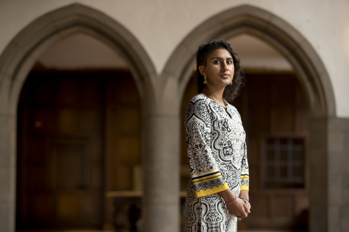 Sheena Sood standing in front of a doorway. 