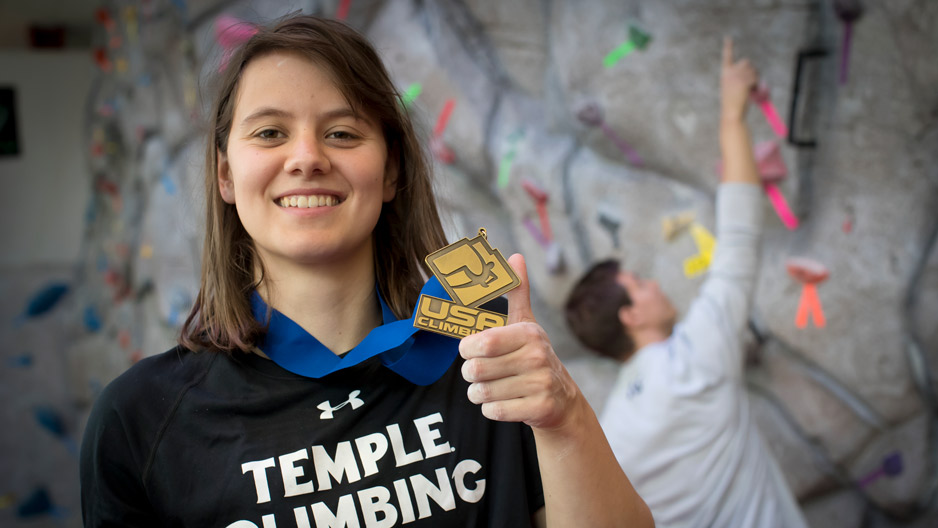 Zoe Steinberg holding up her medal