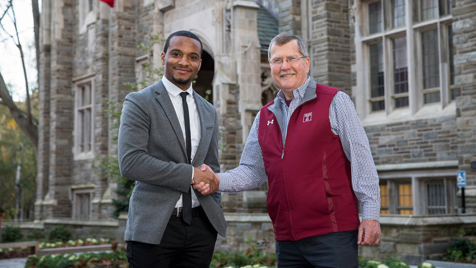 Hazim Hardeman shaking hands with President Richard Englert