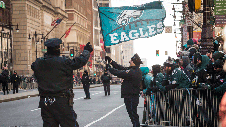 Philadelphia Police officers waving Eagles flag