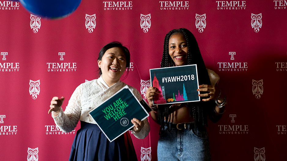 students holding #YouAreWelcomeHere signs