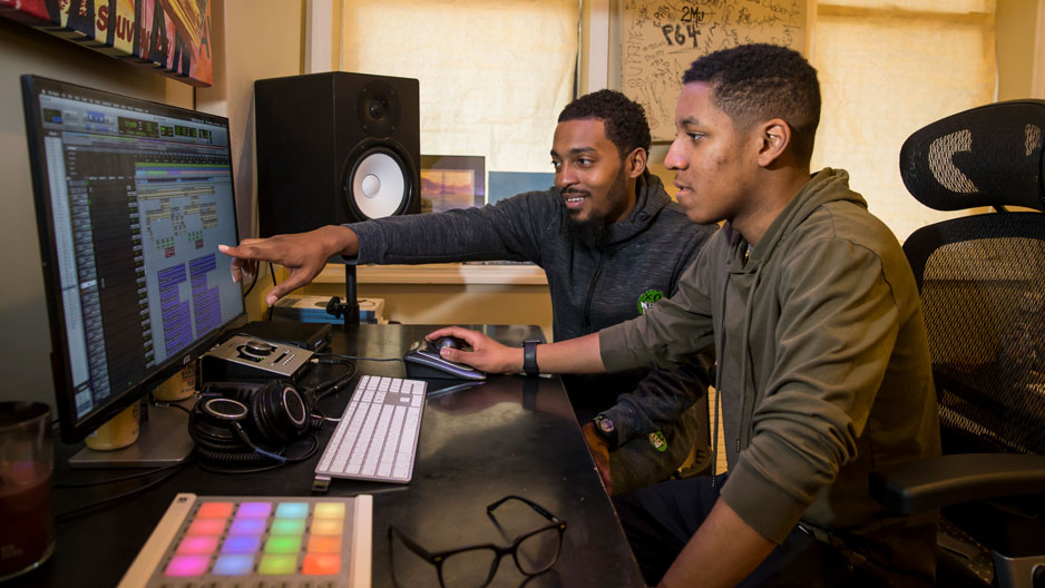 Ben Thomas and Chill Moody editing a track in Thomas’ home studio