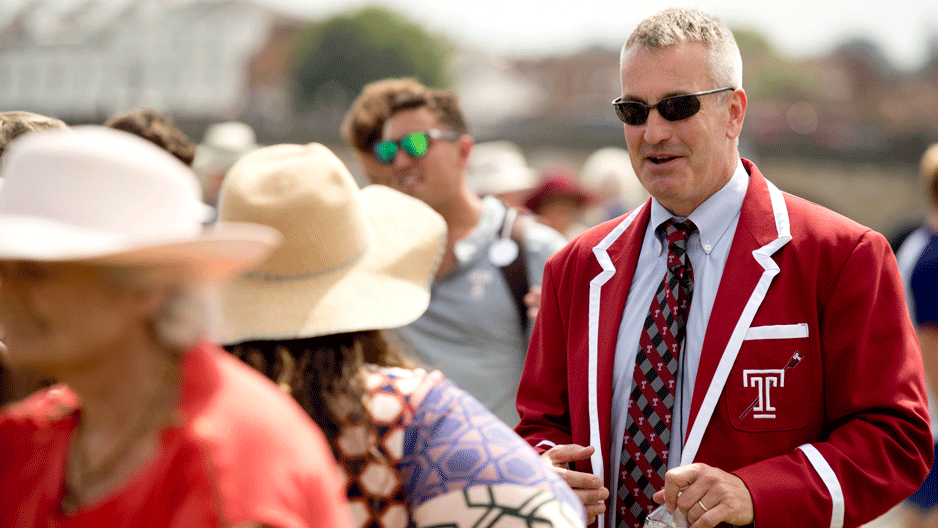 Men's Crew Coach Brian Perkins talks with supporters at the Henley Regatta