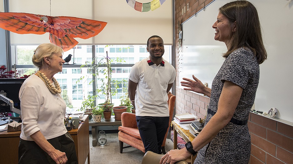 Hazim Hardeman speaking with Honors Program Director Ruth Ost and Fellowship Office Director Barbara Gorka