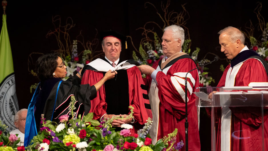 Fran Dunphy on stage at the Liacouras Center receiving his honorary degree