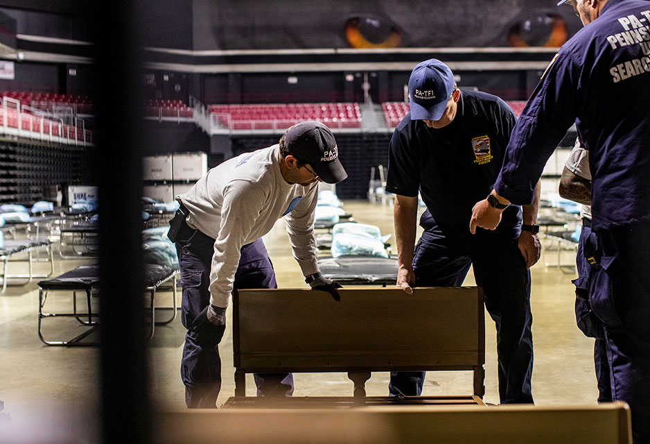 task force members building a hospital bed