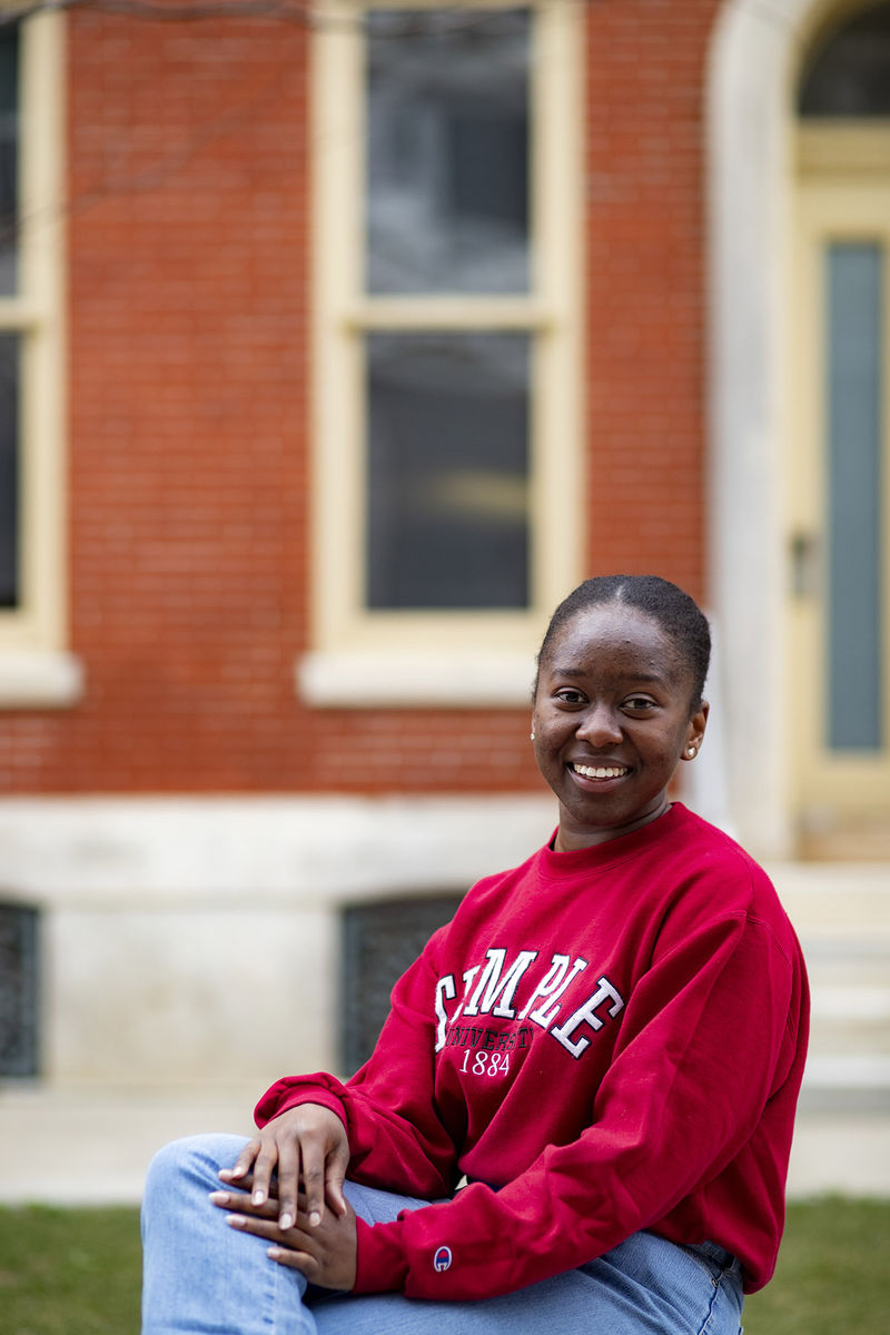 Moraine Kisenda wearing a Temple sweater.