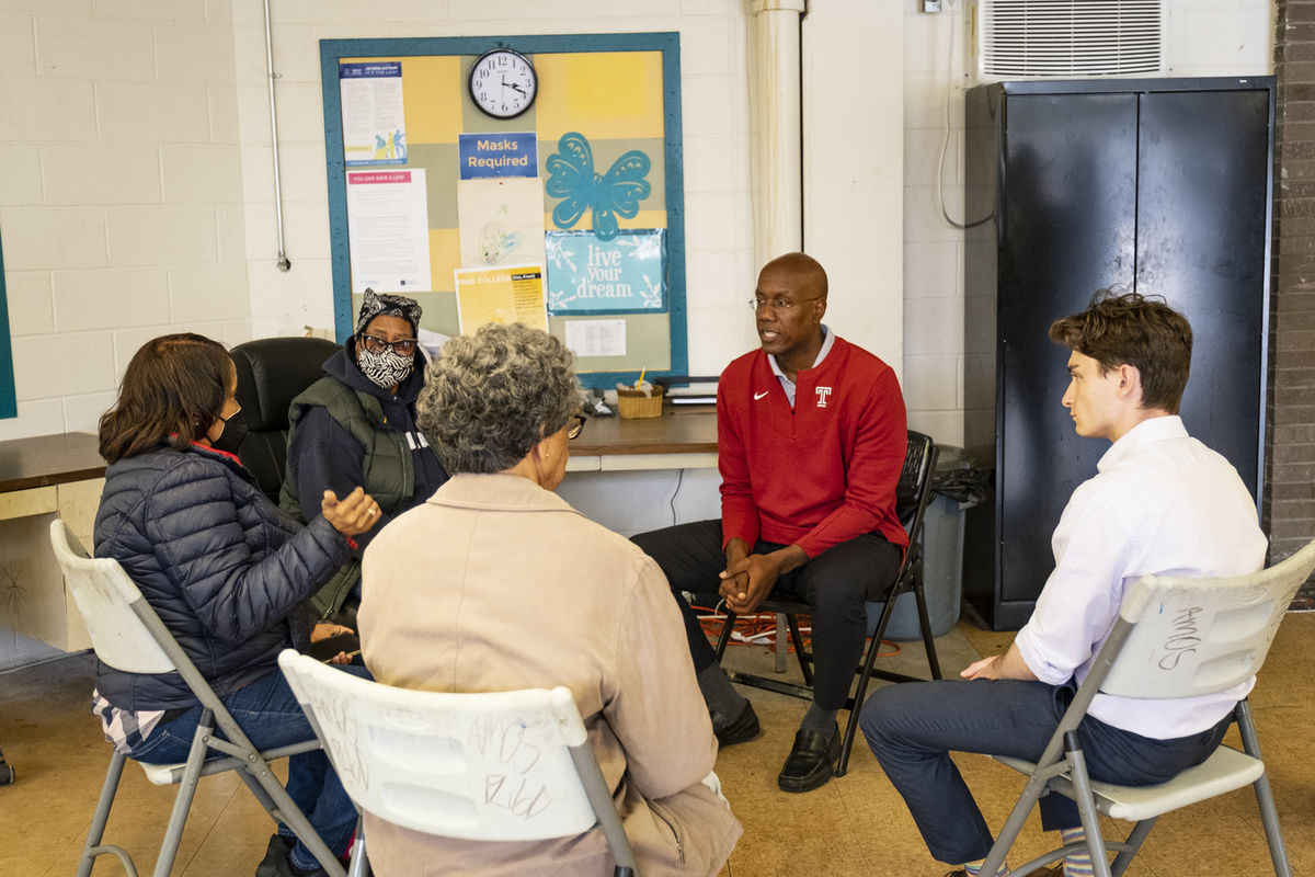 Image of President Wingard meeting with community members at Amos.
