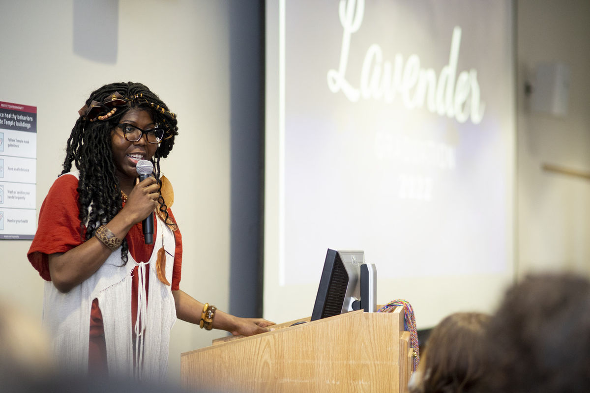 Image of Kendall Stephens speaking into a microphone.