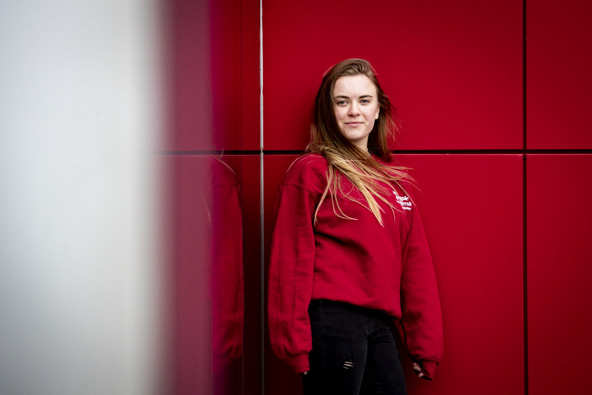 Juliana Alderfer against a red background