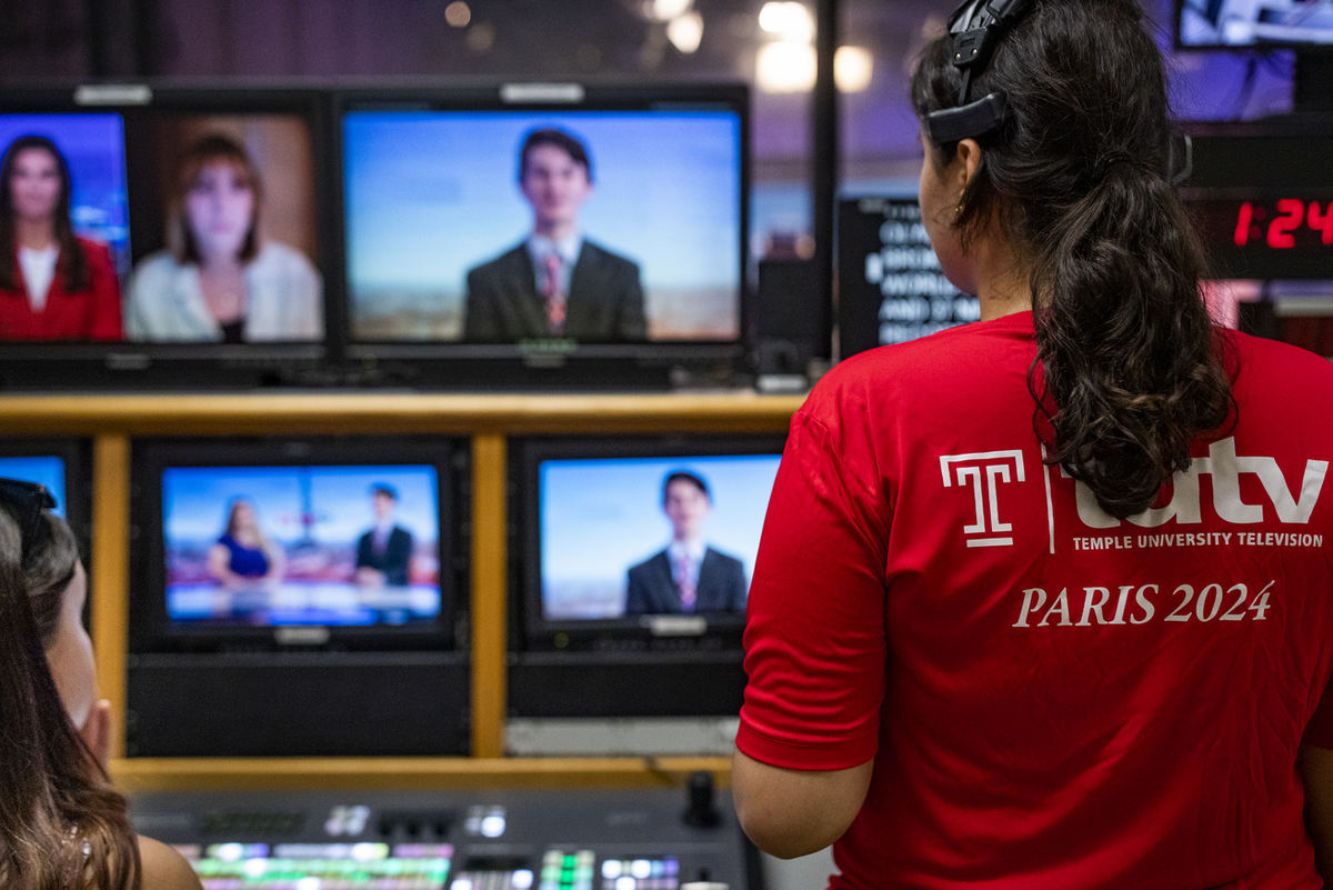 Mariam Akraz pictured behind a news set