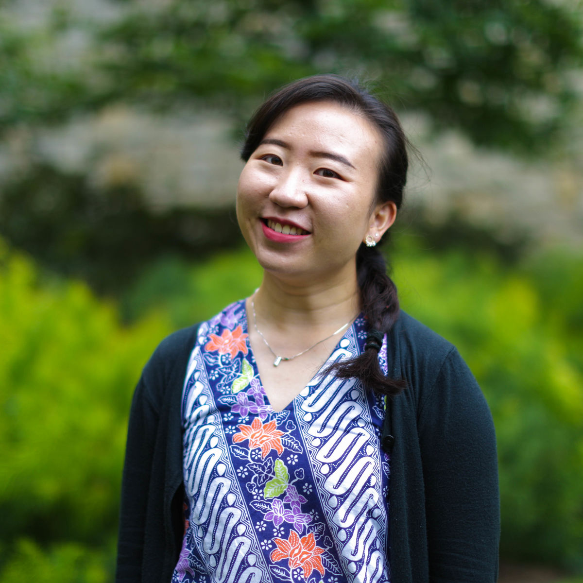 Image of Debora Andriani Sentosa in front of greenery