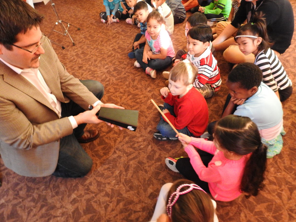 Steve Weiser pictured teaching children about percussion.